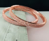 B0197_S_Elegant sleek rose gold bangles engraved with American Diamond stones with delicate stone work.