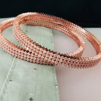 B0197_S_Elegant sleek rose gold bangles engraved with American Diamond stones with delicate stone work.