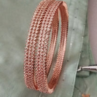 B0197_S_Elegant sleek rose gold bangles engraved with American Diamond stones with delicate stone work.