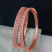 B0197_S_Elegant sleek rose gold bangles engraved with American Diamond stones with delicate stone work.