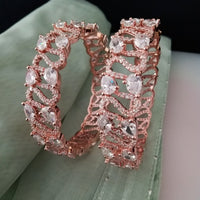 B0196_S_Beguiling broad rose gold designer bangles engraved with American Diamond stones.