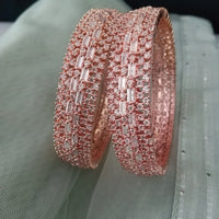 B0200_Grand broad design rose gold bangles studded with American Diamond stones with delicate stone work.