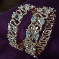B0196_S_Beguiling broad rose gold designer bangles engraved with American Diamond stones.