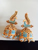 E0781_Lovely peacock design jumkas with delicate art work with a touch of vibrant bead drops studded with dazzling stones.