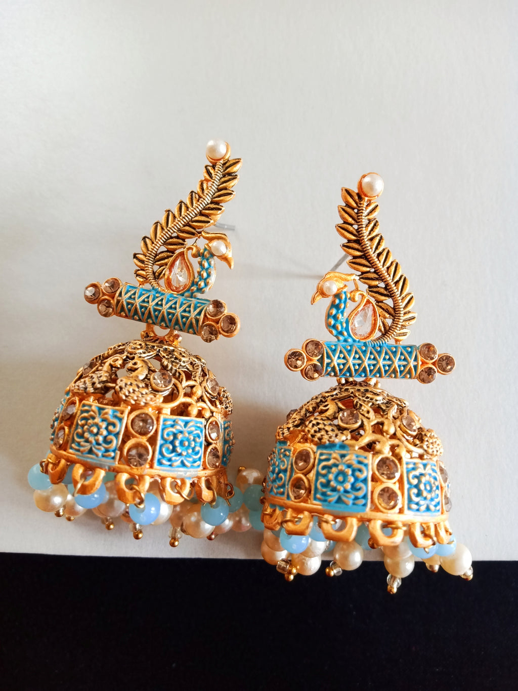 E0781_Lovely peacock design jumkas with delicate art work with a touch of vibrant bead drops studded with dazzling stones.