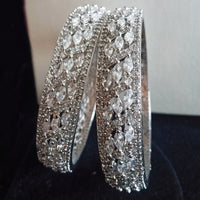 B0158_Elegant design silver crafted bangle studded with American Diamond stones.