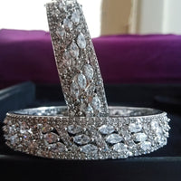 B0158_Elegant design silver crafted bangle studded with American Diamond stones.