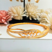 B0203_Elegant design golden color bangle style bracelet studded with dazzling american diamond stones with delicate design.