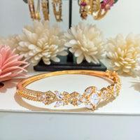 B0192_Elegant golden color bangle style bracelet studded with dazzling american diamond stones with delicate craft work.
