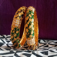 B042_Gorgeous Bangles crafted with delicate meena work with green and red zari combination studded with stones.