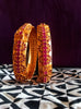 B034_Gorgeous Gold plated bangles matte finish studded with pink ruby stones.