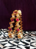 B019_Gorgeous Gold plated Bangles studded with white and pink ruby stones set of 2