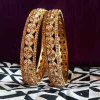 B066_Gorgeous Gold plated bangles  studded with  American Diamond  stones.