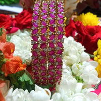 B022_S_Classy Style Gold plated Bangles studded with American Diamond stones .