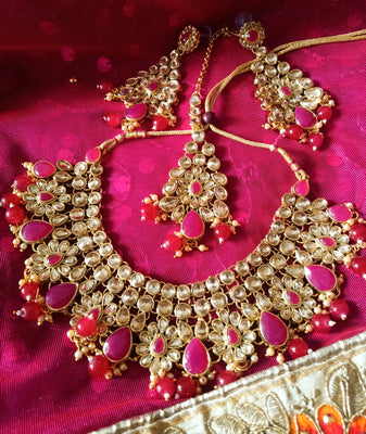 N0300_Lovely elaborated choker necklace set studded with white Kundan stones with a touch of pink stones with glossy bead drops.