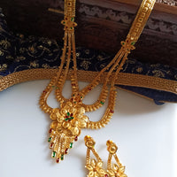 N0176_Ravishing traditional style Gold plated long layered grand necklace set with fine artwork of floral designs studded with pink and green ruby stones with a touch of broad chain drop pendant.