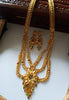 N0176_Ravishing traditional style Gold plated long layered grand necklace set with fine artwork of floral designs studded with pink and green ruby stones with a touch of broad chain drop pendant.