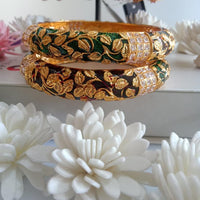 B042_Gorgeous Bangles crafted with delicate meena work with green and red zari combination studded with stones.