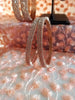B0197_S_Elegant sleek rose gold bangles engraved with American Diamond stones with delicate stone work.