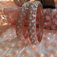 B0198_S_Gorgeous rose gold bangles embellished with American Diamond stones with delicate stone work.