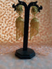 E0835_Gorgeous golden color jumkas with delicate designs with chain drops.