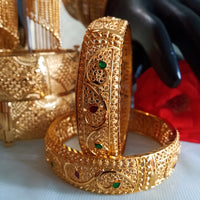 B0169_Gorgeous Crafted Gold plated bangles with delicate designs with a touch of stones.