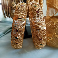 B0170_Gorgeous Crafted Gold plated bangles with beautiful designs with a touch of stones.
