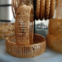 B0189_S_Gorgeous Gold plated screw type adjustable bangles with delicate craft work.