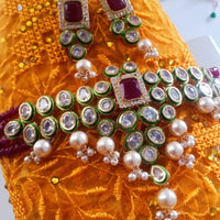 N060_Classy Layered Kundan Necklace studded with dazzling White and bright Square shaped Red stones with a touch of  pearls.