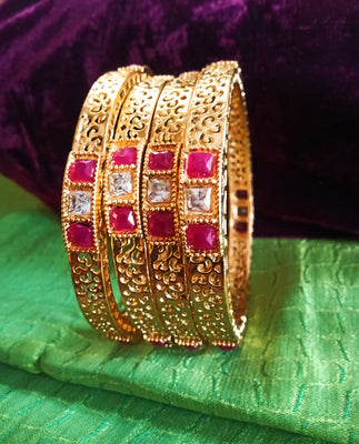 B0221_Beautiful golden bangles with delicate craftwork with a touch of stones.