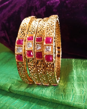 B0221_Beautiful golden bangles with delicate craftwork with a touch of stones.