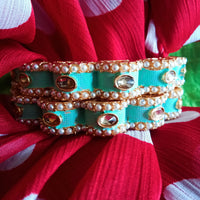 B0218_Gorgeous bangles with vibrant Meena work with a touch of semi precious stones.