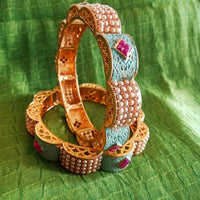 B0219_Gorgeous bangles with vibrant Meena work with a touch of semi precious stones with delicate craft work.