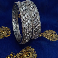 B0158_Elegant design silver crafted bangle studded with American Diamond stones.