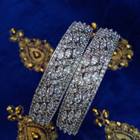 B0158_Elegant design silver crafted bangle studded with American Diamond stones.