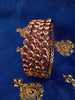 B0154_Elegant pink ruby studded bangles with fine stone work.