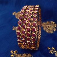B0154_Elegant pink ruby studded bangles with fine stone work.