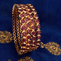 B0154_Elegant pink ruby studded bangles with fine stone work.