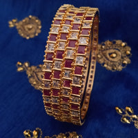 B0165_Elegant Golden bangles studded with a touch of pink ruby stones and American Diamond stones.