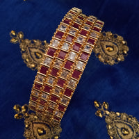 B0165_Elegant Golden bangles studded with a touch of pink ruby stones and American Diamond stones.