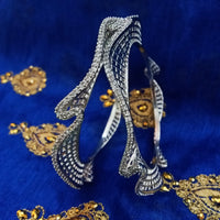 B0215_Elegant trendy designer bangles with delicate designs and unique patterns studded with american diamond stones.