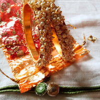 B0222_Lovely golden pearl bangles with delicate craftwork embellished with a bunch of pearls.