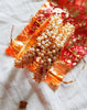 B0222_Lovely golden pearl bangles with delicate craftwork embellished with a bunch of pearls.