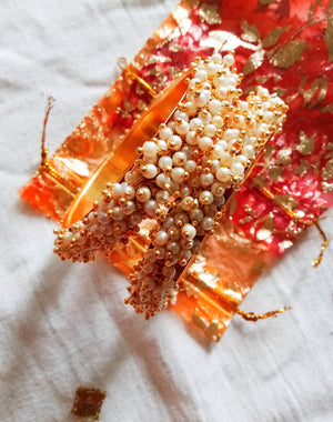 B0222_Lovely golden pearl bangles with delicate craftwork embellished with a bunch of pearls.
