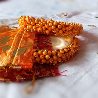 B0223_Lovely golden pearl bangles with delicate craftwork embellished with pearls.