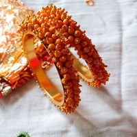 B0223_Lovely golden pearl bangles with delicate craftwork embellished with pearls.