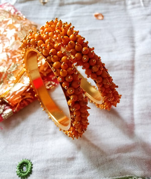 B0223_Lovely golden pearl bangles with delicate craftwork embellished with pearls.