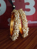 B0222_Lovely golden pearl bangles with delicate craftwork embellished with a bunch of pearls.