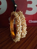 B0222_Lovely golden pearl bangles with delicate craftwork embellished with a bunch of pearls.