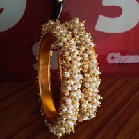 B0222_Lovely golden pearl bangles with delicate craftwork embellished with a bunch of pearls.